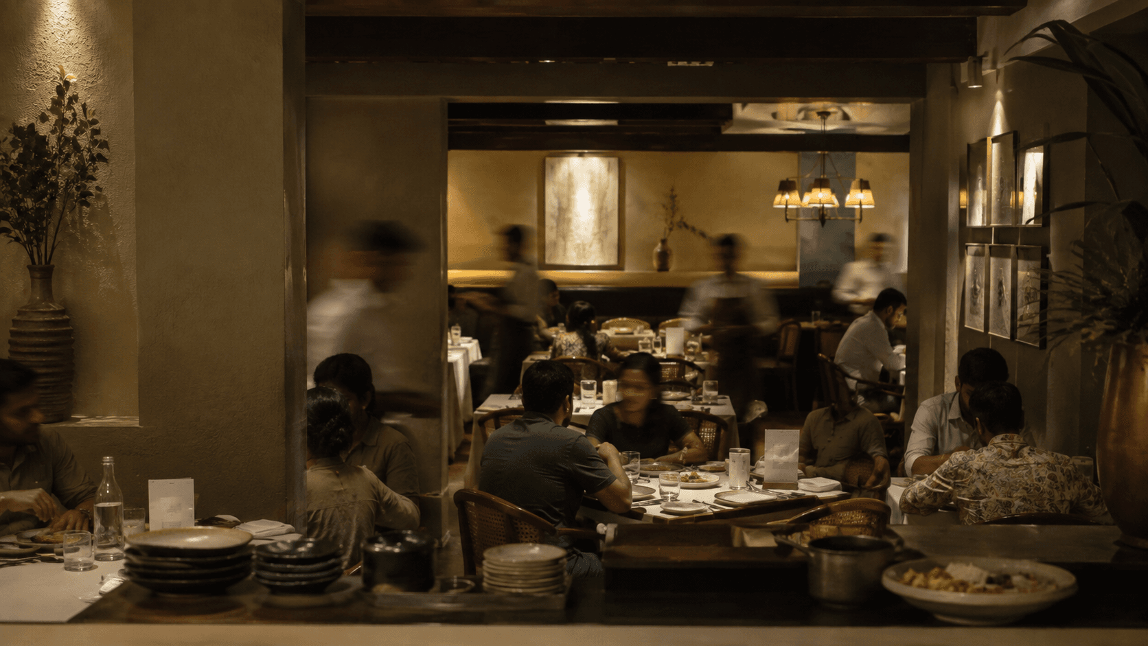 A dining room during service, seen from the pass